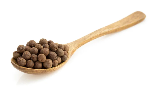 Allspice in spoon  on white — Stock Photo, Image