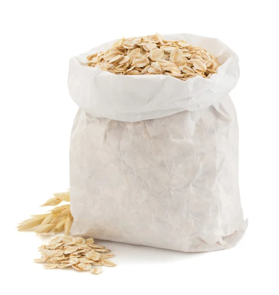 Oat flakes in paper bag — Stock Photo, Image