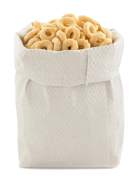 Corn flakes rings in paper bag — Stock Photo, Image