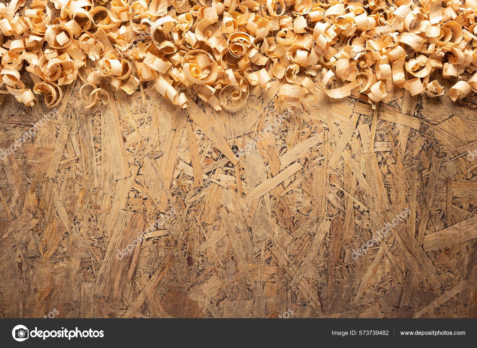 Wood shaving on table background. Wooden shaving at old plank board texture  Stock Photo by seregam