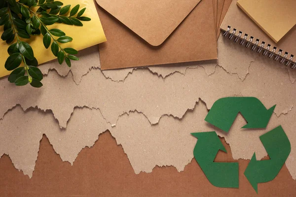 Recycling concept  and waste paper heap. Recycle symbol and product from recycled paper