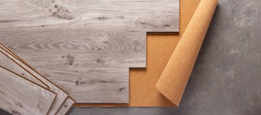 Wood laminate background at floor texture. Wooden laminate heap top view