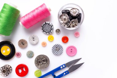 Sewing accessories and supplies at white background. Creative tailor concept