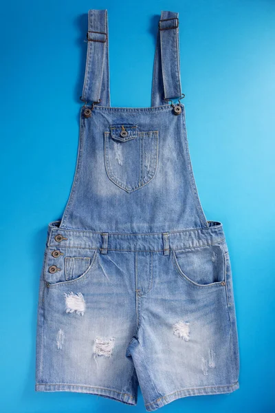 Blue jeans overall denim at blue background