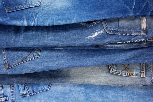 Pantalones Vaqueros Azules Fondo Montón Denim Jeans Pila Tela Bolsillo —  Fotos de Stock