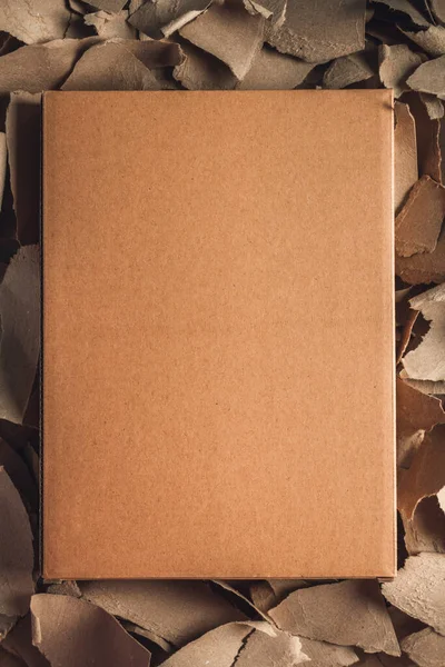 Waste paper with cardboard box background texture. Recycling concept and brown cardboard heap