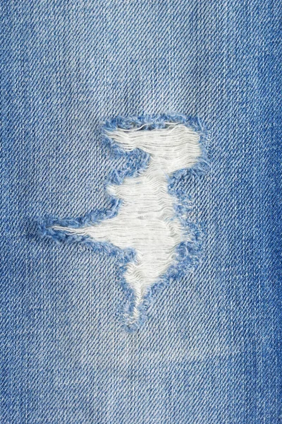 Calça Rasgada Textura Fundo Ganga Calça Jeans Azul Tecido Closeup — Fotografia de Stock