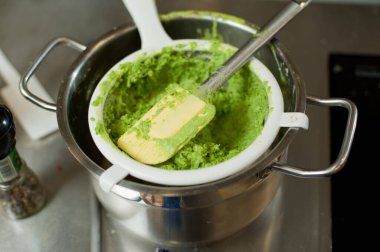 Cook cooks mashed peas.