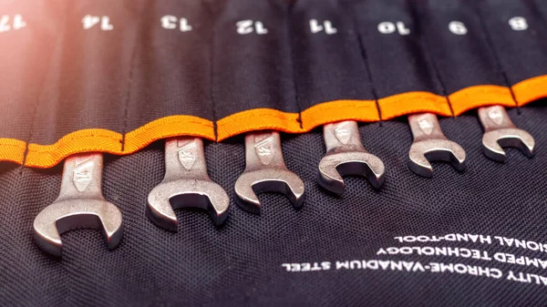 Set of open-end wrenches in a fabric cover