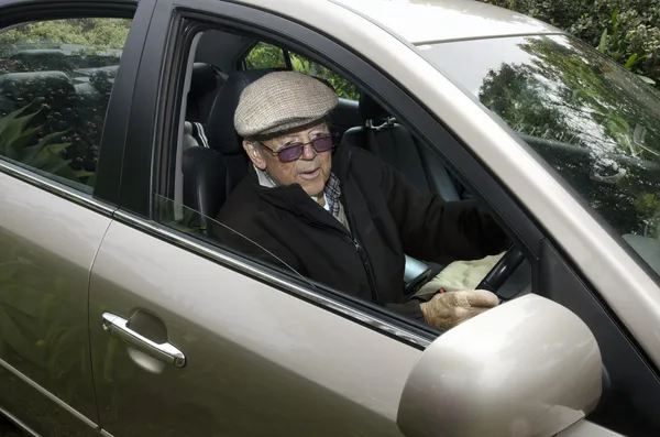 Old man driving a car — Stock Photo, Image