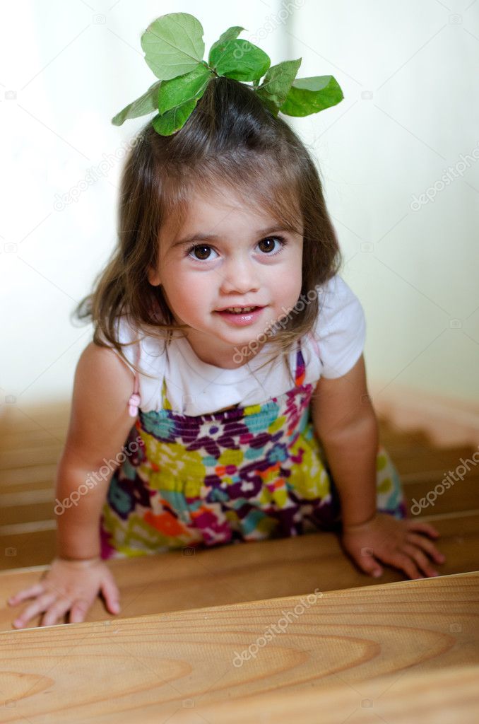 A child is climbing up stairs.