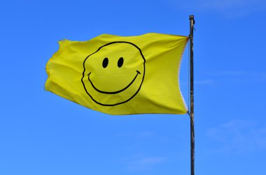Yellow flag with smiley face clipart