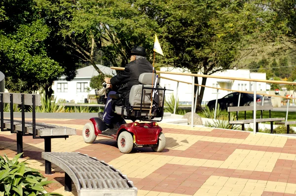 Elderly man drive mobility scooter — Stock Photo, Image