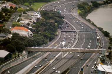Aerial view of traffic on Auckland inner city road clipart