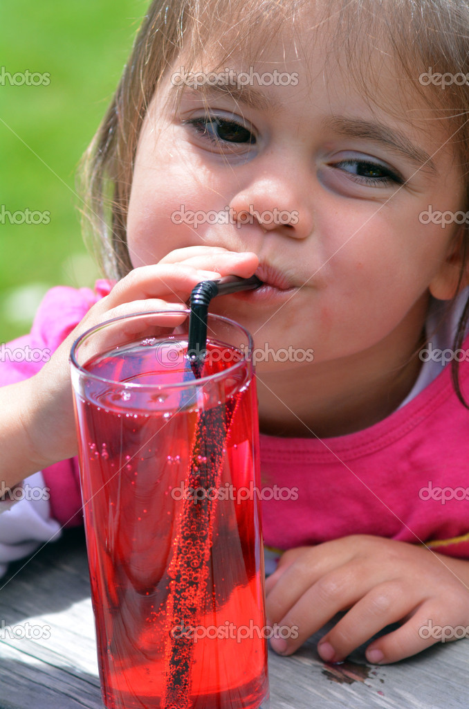 Girl drinks juice — Stock Photo © lucidwaters 39994441