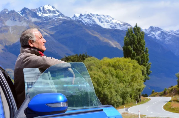 Mature man travel by car — Stock Photo, Image