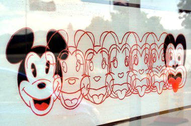 The lithograph Mickey to Tiki clipart