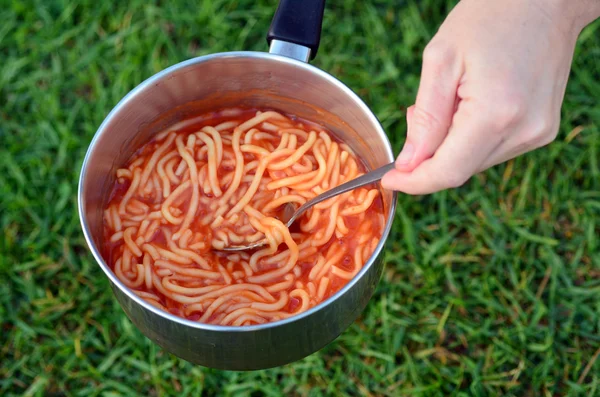 Caned spaghetti cooked outdoors — Stock Photo, Image