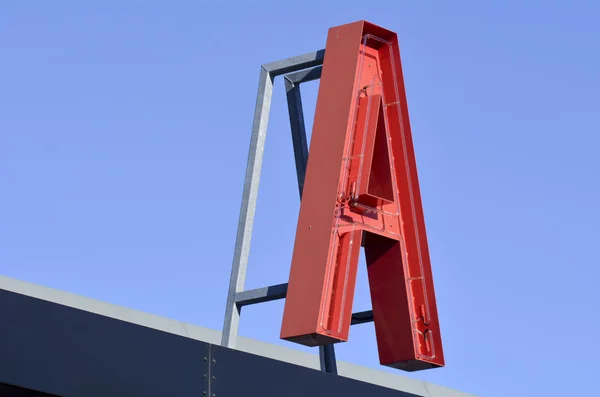 Ein Buchstabe neon sign rot — Stockfoto