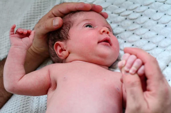 Newborn baby in a cot — Stock Photo, Image