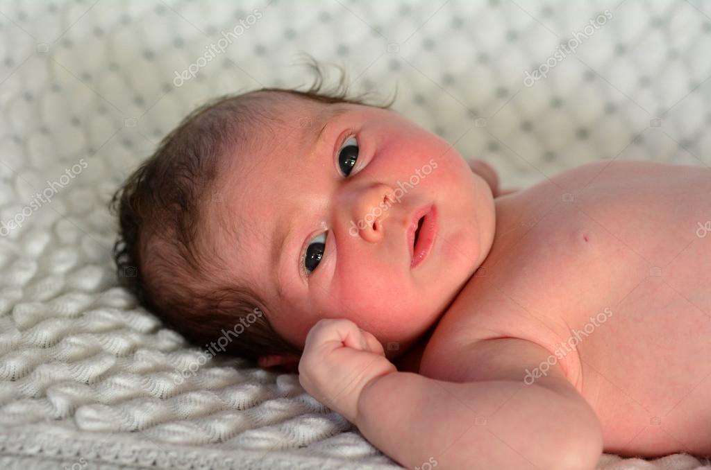 Newborn baby in a cot Stock Photo by ©lucidwaters 49188343