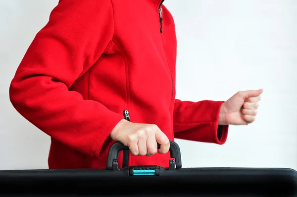 Hands of a woman carry travel suitcase — Stock Photo, Image
