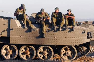 Israeli soldiers on armed vehicle clipart