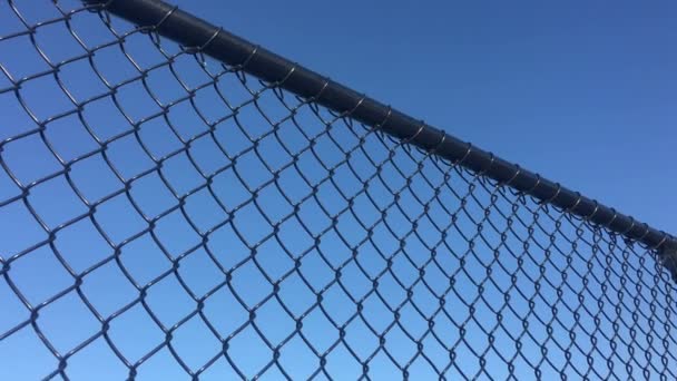 Low Angle View Cycloon Chain Wire Mesh Fencing Blue Sky — Stockvideo