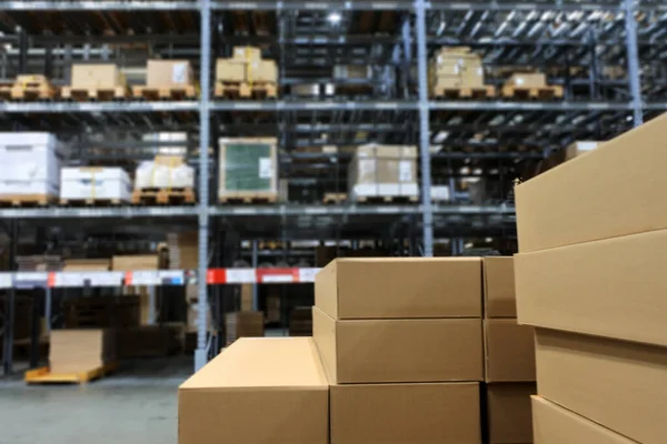 Blurred Background Many Items Cardboard Boxes Warehouse Storage Shelves — Stock Photo, Image