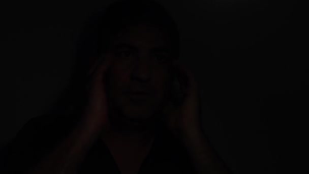 Shocked Man Emerging Dark — Stock Video