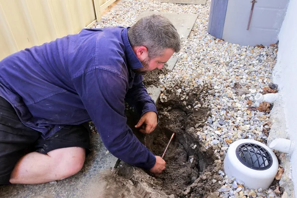 Australian Plumber Fixing Underground Hot Water Pipe Leaking — Stock Photo, Image