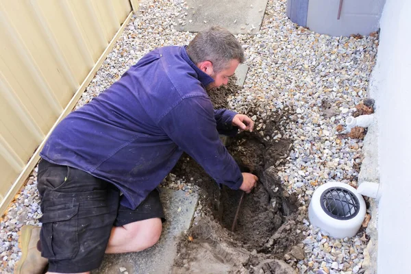 Australian Plumber Fixing Underground Hot Water Pipe Leaking — Stock Photo, Image