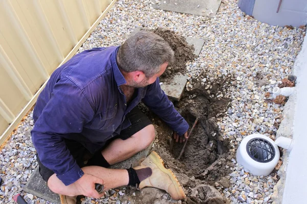 Australian Plumber Fixing Underground Hot Water Pipe Leaking — Stock Photo, Image