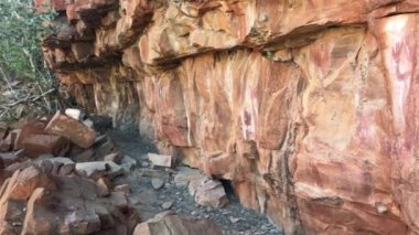 Wandjina dreamtime images a cloud and rain spirits from Australian Aboriginal mythology painted on rock gallery in Kimberley Western Australia.