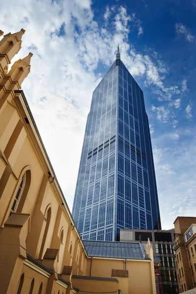 Skycrapper and church — Stock Photo, Image