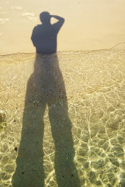 Skugga på stranden — Stockfoto