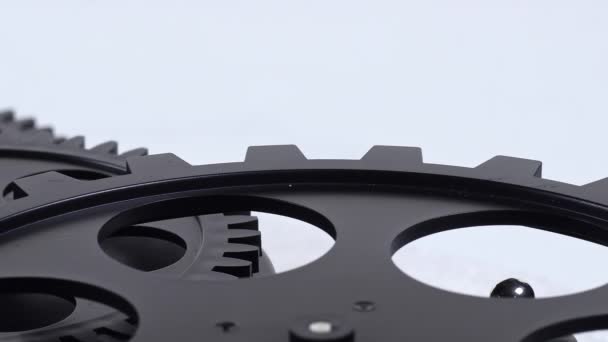 Close Shot Black Gear Cogs Rotating Working Footage — Stockvideo