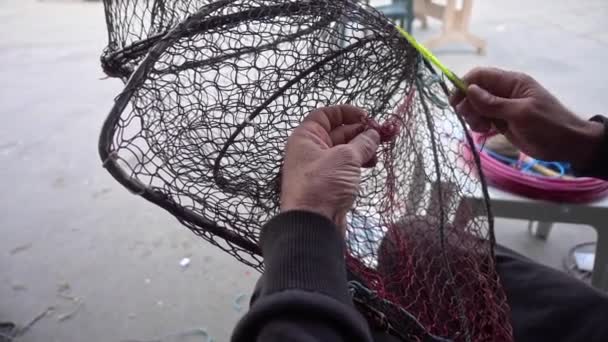 Fisherman Repairs Folding Fish Trap Net Marine — Stock Video