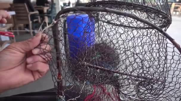 Fisherman Repairs Folding Fish Trap Net Marine — Stock Video