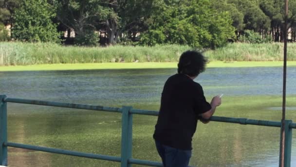 Thoughtful Lonely Senior Man Smoking Cigarette Looking Lake View — Stok video