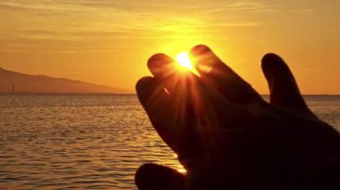 Sunset and Human Hand Gestures.