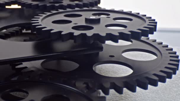 Black Gears Working Synchronously Moving Together — Vídeo de Stock