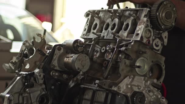 Car Master Assembles Refurbished Car Engine Parts Air Screwdriver Workshop — Video Stock