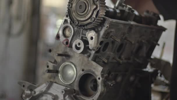 Car Master Assembles Refurbished Car Engine Parts Air Screwdriver Workshop — Vídeo de Stock