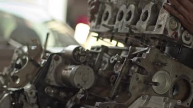 Car Mechanic Removes Valve Cover of Broken Car Engine in Workshop Footage.