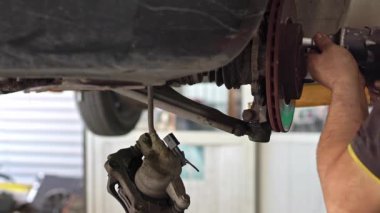 Replacing Car Brake Discs in the Workshop Footage.