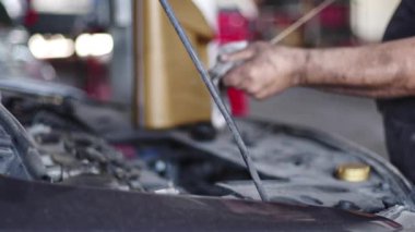 Car Engine Oil Level Check With Dipstick Blurry Footage.