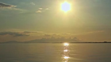 Rain Drops on Ocean at Yellow Glitter Sunset Footage.