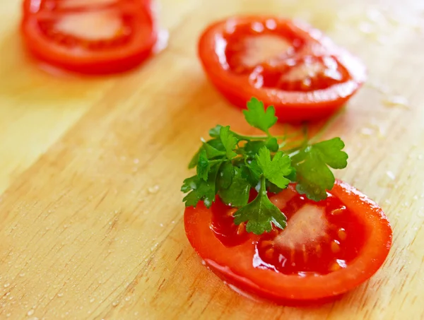 Fresh sliced tomato with water drops on it — Stock Photo, Image