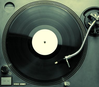 Top view of old fashioned turntable playing a track clipart